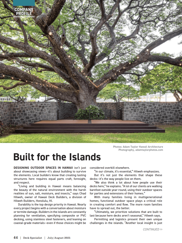 Custom deck built beneath a large monkeypod tree with string lights, featured in Deck Specialist magazine's “Built for the Islands” profile of Hawaii Deck Builders