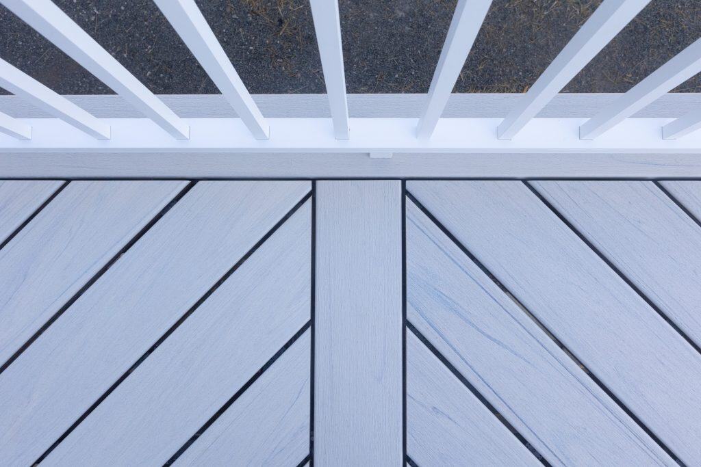 Close up of Trex Salt Flat composite decking showing diagonal deck boards with a clean breaker board detail from the Trex Transcend Lineage line